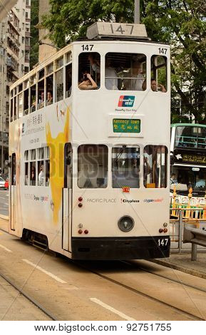 HONG KONG - JUNE 03, 2015: double-decker tram on street of HK. Hong Kong Tramways is a tram system in Hong Kong, being one of the earliest forms of public transport in the metropolis.