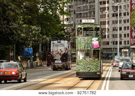 HONG KONG - JUNE 03, 2015: double-decker tram on street of HK. Hong Kong Tramways is a tram system in Hong Kong, being one of the earliest forms of public transport in the metropolis.