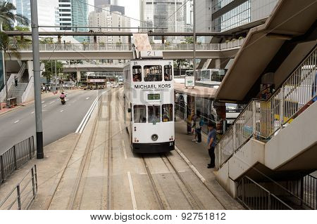 HONG KONG - JUNE 02, 2015: double-decker tram on street of HK. Hong Kong Tramways is a tram system in Hong Kong, being one of the earliest forms of public transport in the metropolis. 