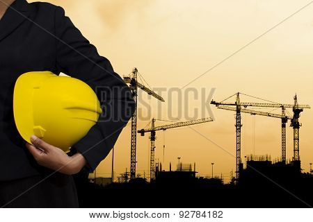 Engineer Holding Yellow Helmet