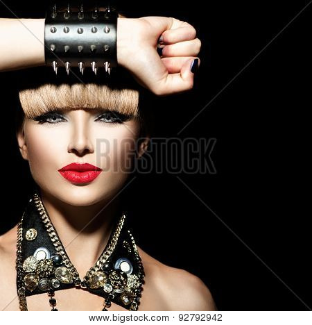 Beauty Punk Fashion Model Girl. Rocker Style Model Portrait. Fringe Hairstyle. Rocker or Punk Woman Makeup and Accessories. Isolated on black background
