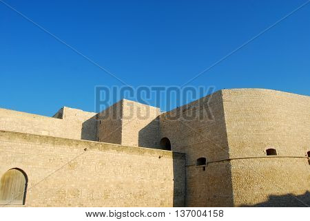 The mighty walls of the Castle Svevo Trani in Apulia - Italy