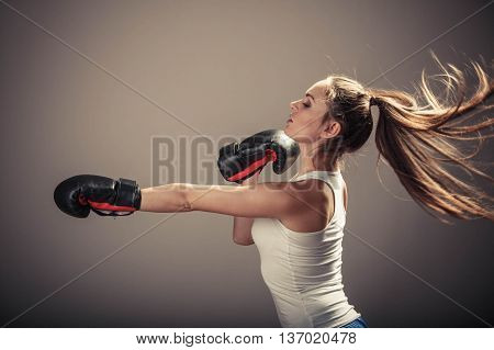 Energetic Young Woman Fight With Boxing Gloves.