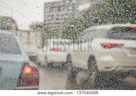 Drive in a rainy day - Rain drops on windshield car