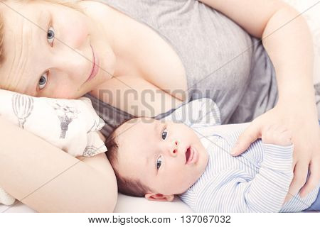 Close up of mother and baby cuddling