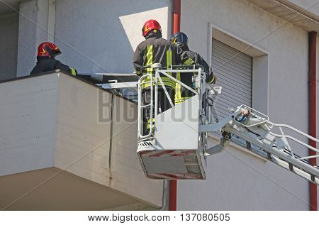 Two Firefighters In The Cage Of Fire Engine