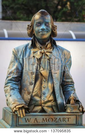 Bucharest, Romania - June 10, 2016: W.A Mozart living statue at B-FIT in the Street. B-FIT is a cultural event that involves international artists and acrobats who act in theater plays on street.