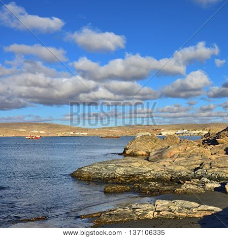 The Luderitz bay at sunset Luderitz is a harbour town lying on one of the least hospitable coasts in Africa. Warm evening light
