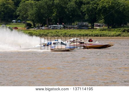 Madison Indiana - July 2 2016: Steve Kuhr II in the GNH 317 Danny Walls in the GNH 68 and matt Mattson in the GNH 76 race in the Grand National Hydroplane Qualification Heat #1 at the Madison Regatta in Madison Indiana July 2 2016.