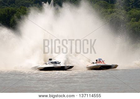 Madison Indiana - July 2 2016: Kevin Kreitzer in the GNH 515 and Scott Liddycoat in the GNH 18 race in the National Modified Saturday qualification heat #2 at the Madison Regatta in Madison Indiana July 2 2016.
