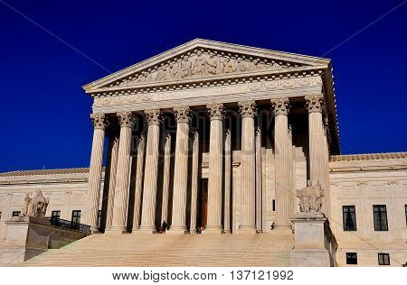 Washington DC - April 12 2014: The imposing neo-classical facade with Corinthian columns and bas relief pediment of the U. S. Supreme Court *