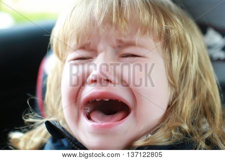 Small Boy Crying In Car