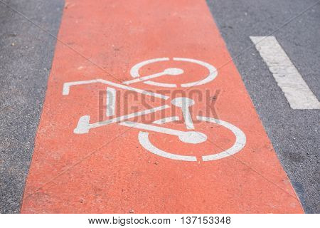 Bicycle sign on the red bicycle lane.