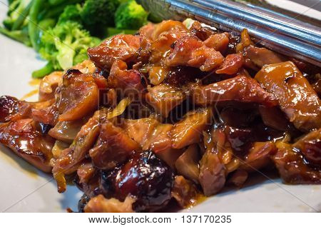 Chinese food buffet self service Teriyaki chicken with broccoli