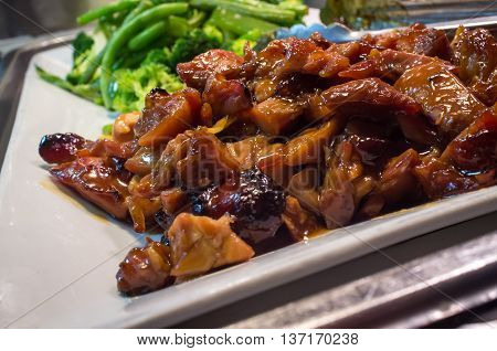 Chinese food buffet self service Teriyaki chicken with broccoli