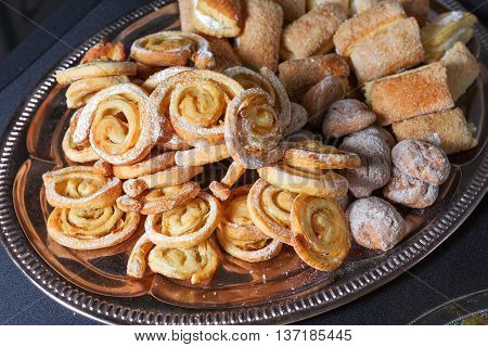 Pretzels, powdered sugar, laid out on a platter