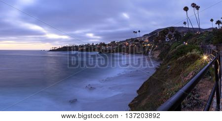 Dark clouds over Diver's Cove in Laguna Beach at sunset in the summer.
