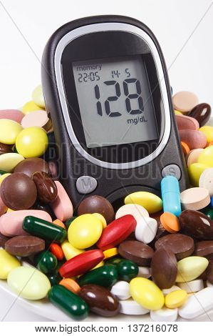Glucometer With Result Sugar Level And Heap Of Medical Pills And Capsules, Diabetes, Health Care Con