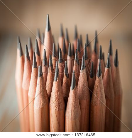Sharp pencils with wooden background. close-up pencils