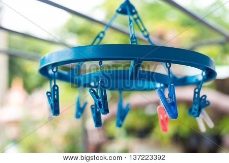 Plastic clothes pegs in blur background, washing, home work