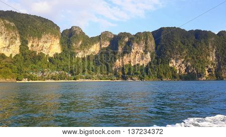 Cliffs near Ao Nung, Thailand, seen from a Thai longtail boat