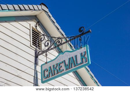 COULTERRVILLE, CA, USA - OCTOBER 9, 2015: Vintage cakewalk sign on a building in main street Coulterville, California