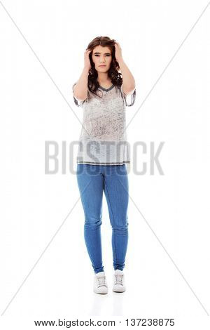 Young unhappy woman with long dark hair.