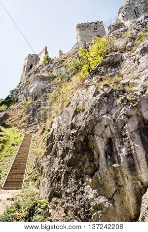 Beckov castle ruins Slovak republic central Europe. Vertical composition. Travel destination. Beautiful place. Cultural heritage. Big rock.