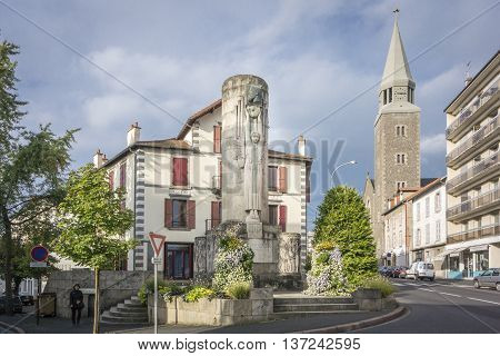 AURILLAC, FRANCE, 12 SEPTEMBER 2013 - Monument of Paul Doumer and the Sacre Coeur church in Aurillac France