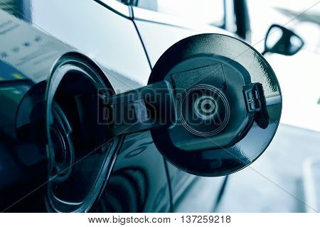 closeup of the fill cap of the fuel tank of a car
