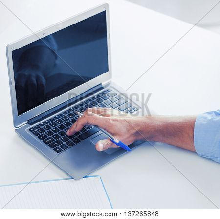 business, office, school and education concept - smiling businessman working in office