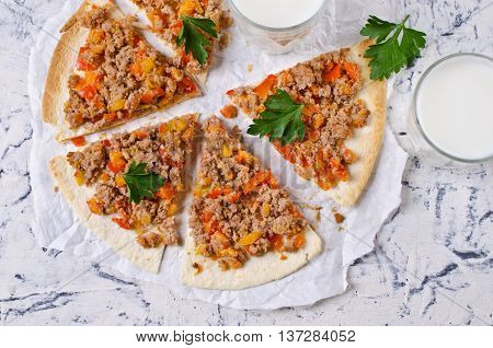 Traditional Asian thin tortilla with minced meat and vegetables. Selective focus.