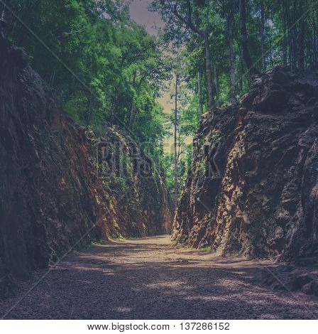 Hellfire Pass in Kanchanaburi Thailand - built during World War II. Vintage filtered effect image.