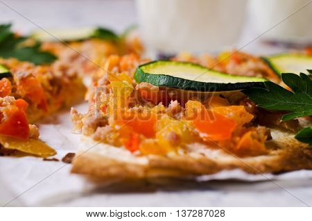 Traditional Asian thin tortilla with minced meat and vegetables. Selective focus.