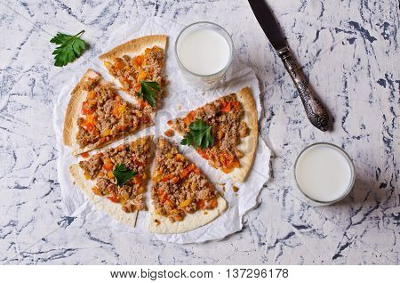 Traditional Asian thin tortilla with minced meat and vegetables. Selective focus.