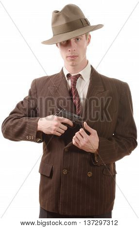 a gangster in a suit vintage with handgun on white background