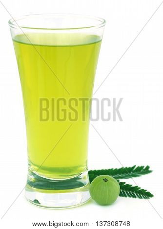 Herbal amla juice with fresh fruit over white background