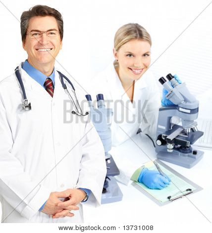 Science team working with microscopes in a laboratory