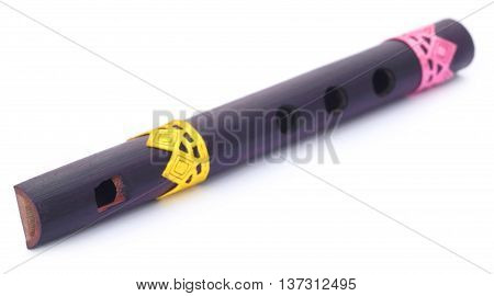 Bamboo flute of Indian subcontinent over white background