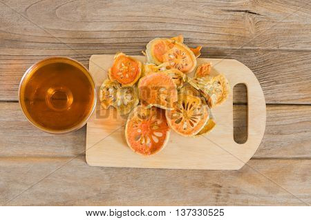 water quince with quince on wooden table