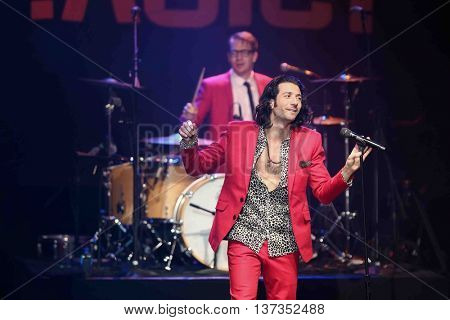 HUNTINGTON, NY-MAR 7: Singer Nasri (foreground) of the reggae fusion band Magic! performs in concert at The Paramount on March 7, 2015 in Huntington, New York.