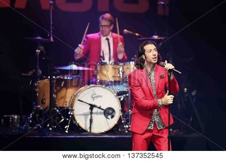 HUNTINGTON, NY-MAR 7: Singer Nasri (R) of the reggae fusion band Magic! performs in concert at The Paramount on March 7, 2015 in Huntington, New York.