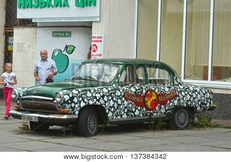  Exterior of the vintage Soviet car GAZ-21 Volga with folk stile tuning. July 6, 2016 in Kiev, Ukraine