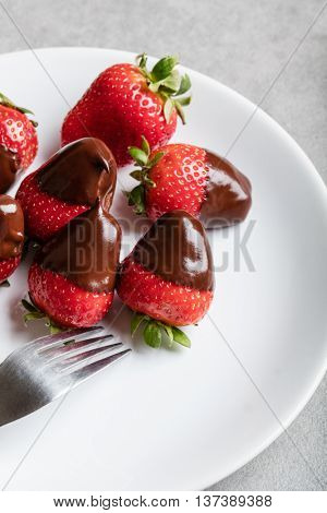 Juicy strawberry with milk chocolate