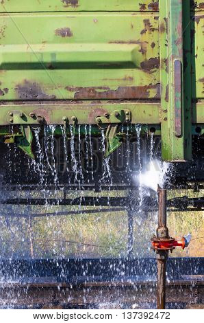washing of freight wagons - old industrial railway junction on a summer afternoon