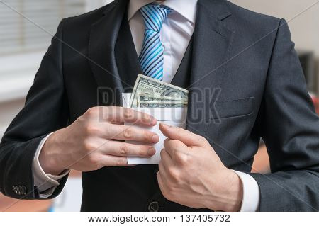 Corruption Concept. Businessman Is Hiding Letter Full Of Money O