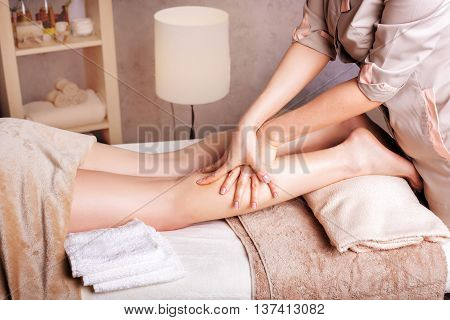 Woman having anticellulite foot massage. Spa Salon therapeutic foot massage
