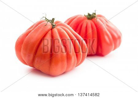 Coeur De Boeuf. Beefsteak tomatoes isolated on white background.