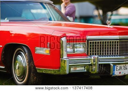 MINSK BELARUS - MAY 07 2016: Close-up photo of the red Cadillac Eldorado 1976 model year. Vintage retro car. Selective focus.