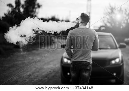 Vaper With Beard In Sunglasses Vaping Outdoor